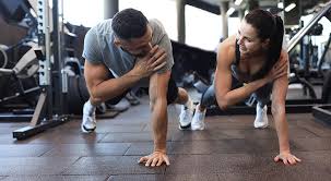 Sculpting Sleek Arms: The Essential Role of Cardio in Toning Without Bulking Up 1 Image of man and woman doing Cardio York to tone their arms.